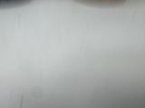 a man riding a snowboard down a snow covered slope
