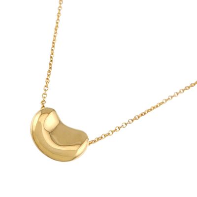 the gold plated necklace has a crescent shaped pendant on a gold chain
