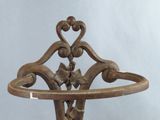 a metal stand that has a flower design on it