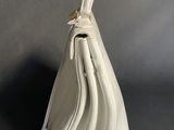 the white purse is sitting on the table with the zipper open