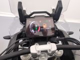 a close up of a motorcycle ' s dashboard with a display on it