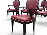 six chairs with red upholstered seats and black legs