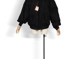 black jacket on a mannequin stand with a tag on it