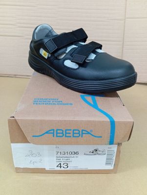 a box with a pair of shoes on top of it
