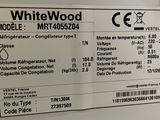 a picture of a white wood refrigerator with a price label on it