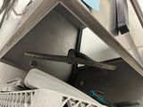 a metal shelf that has a bunch of items in it