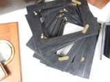 a pile of black cards sitting on a table next to a purse
