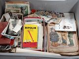 a box full of old books and papers in it
