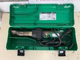 a green box that has a drill in it