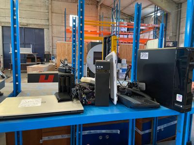 a blue shelf with a computer and a monitor on it