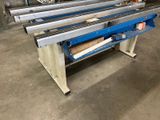 the machine is sitting on the floor in the warehouse