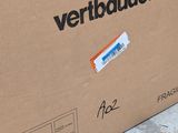 a cardboard box with a sticker on it sitting on the ground