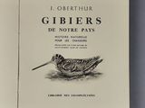 an open book with a drawing of a bird on it