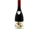 a close up of a bottle of wine on a white background