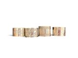 four different types of brass rings on a white background