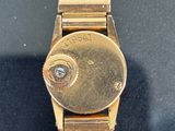 an image of a close up of a wrist watch on a table