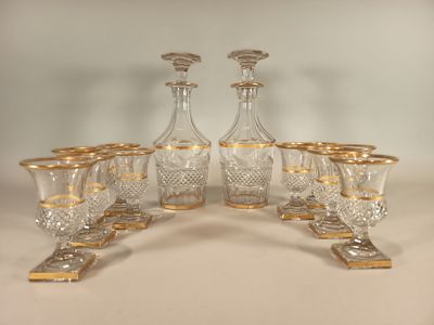 a group of glasses and a decanter on a table
