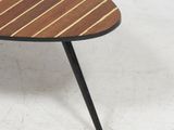 a close up of a coffee table with a wooden top and black legs