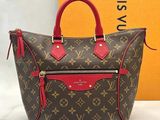 louis vuitton monogram canvas and leather handbag with red trim