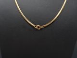a gold plated necklace on a mannequin mannequin mannequin mannequin mannequin mannequin mannequin mannequin mann