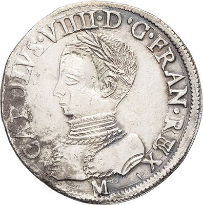 a close up of a silver coin with a woman ' s face on it