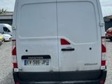 a white van that is parked in a parking lot