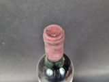a bottle of wine that is sitting on a table