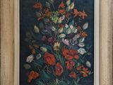 painting of a bouquet of flowers in a wooden frame on a wall