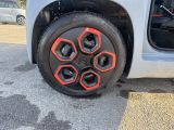 a close up of a tire on the side of a car