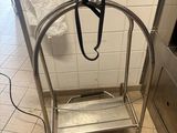 a metal cart with a handle on it in a kitchen