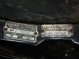 a close up of a car ' s license plate on the hood of a car
