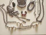 a table that has a bunch of jewelry on it