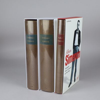 two books sitting on top of each other on a table