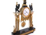 a clock that is sitting on top of a table