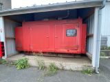 a red fire hydrant sitting in front of a building