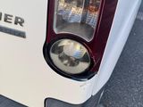 a close up of the tail light of a white truck