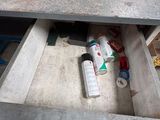 a desk with a drawer that has a lot of stuff in it