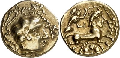 a gold coin with an image of a man riding a horse