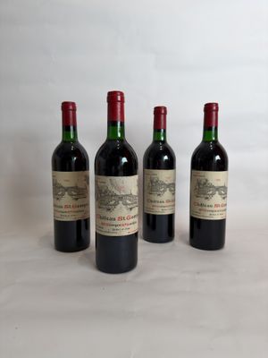 three bottles of red wine are lined up on a table