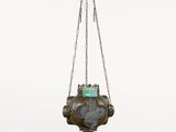 a metal hanging planter with a blue stone in it