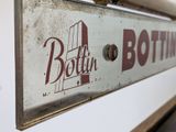 a sign that says both bottling on the side of a building