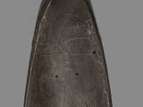 a close up of a metal object on a gray background