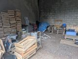 a pile of wooden pallets and crates in a room