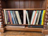a book shelf with a bunch of books on top of it