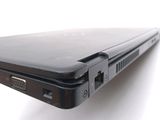a close up view of a laptop computer on a white surface