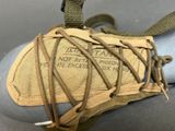 an old pair of shoes with laces on them sitting on a table