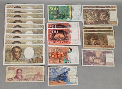 several different bank notes are laid out on a table