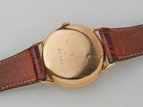 an image of a close up of a watch on a white surface