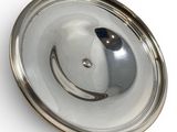 a silver plate with a smiley face on it