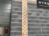 a large wooden ruler on the side of a building